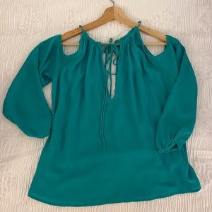 Divided spring green blouse with cutout embellishments